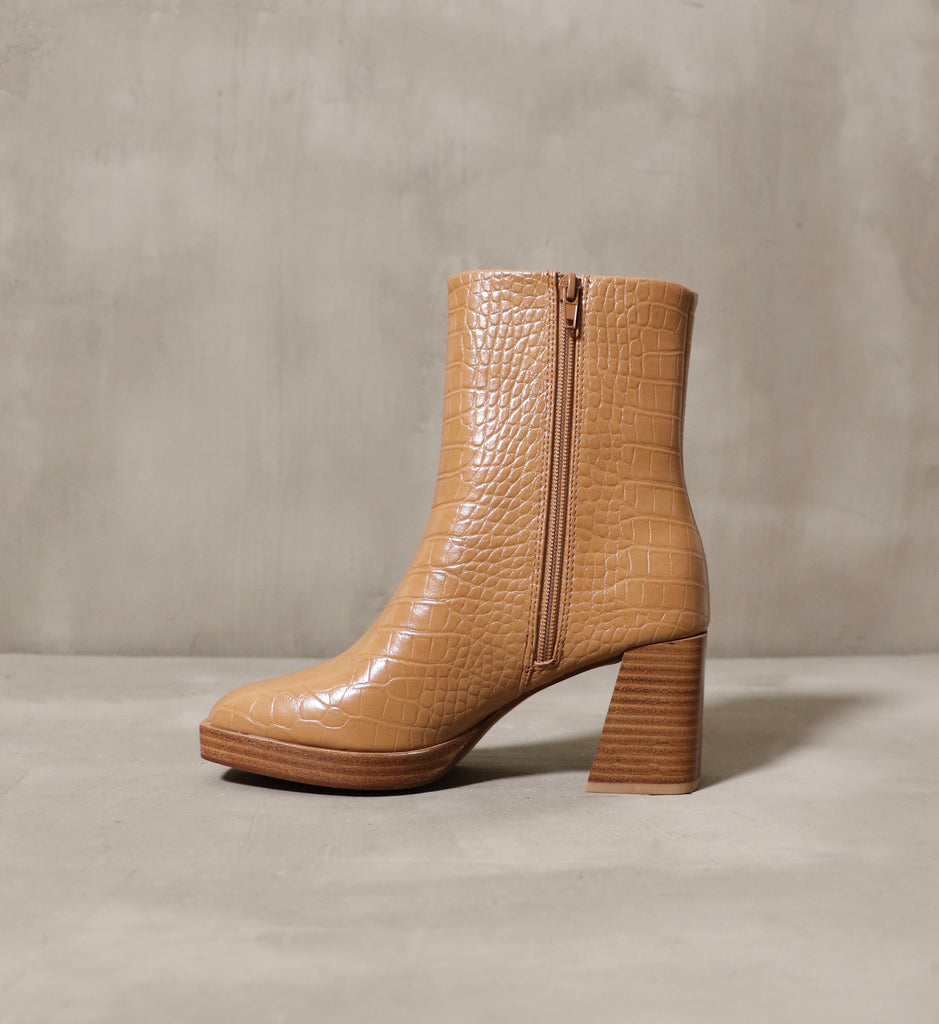 The Out on A High Bootie in camel has a textured outer and a zipper for easy on and off use.