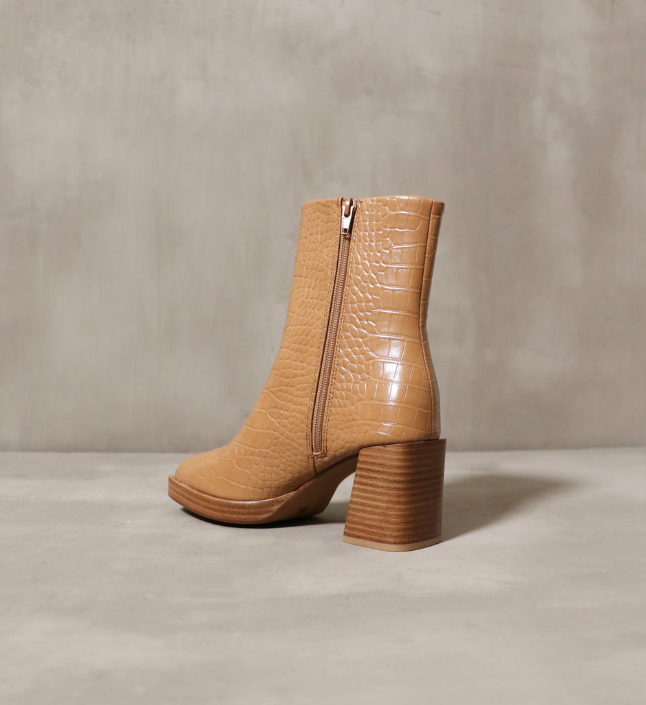 A camel bootie with a 3" stacked heel and zipper closure - Elle Bleu