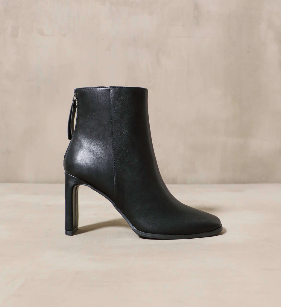Black zip up ankle boot with a thin rectangular heel - Elle Bleu Shoes