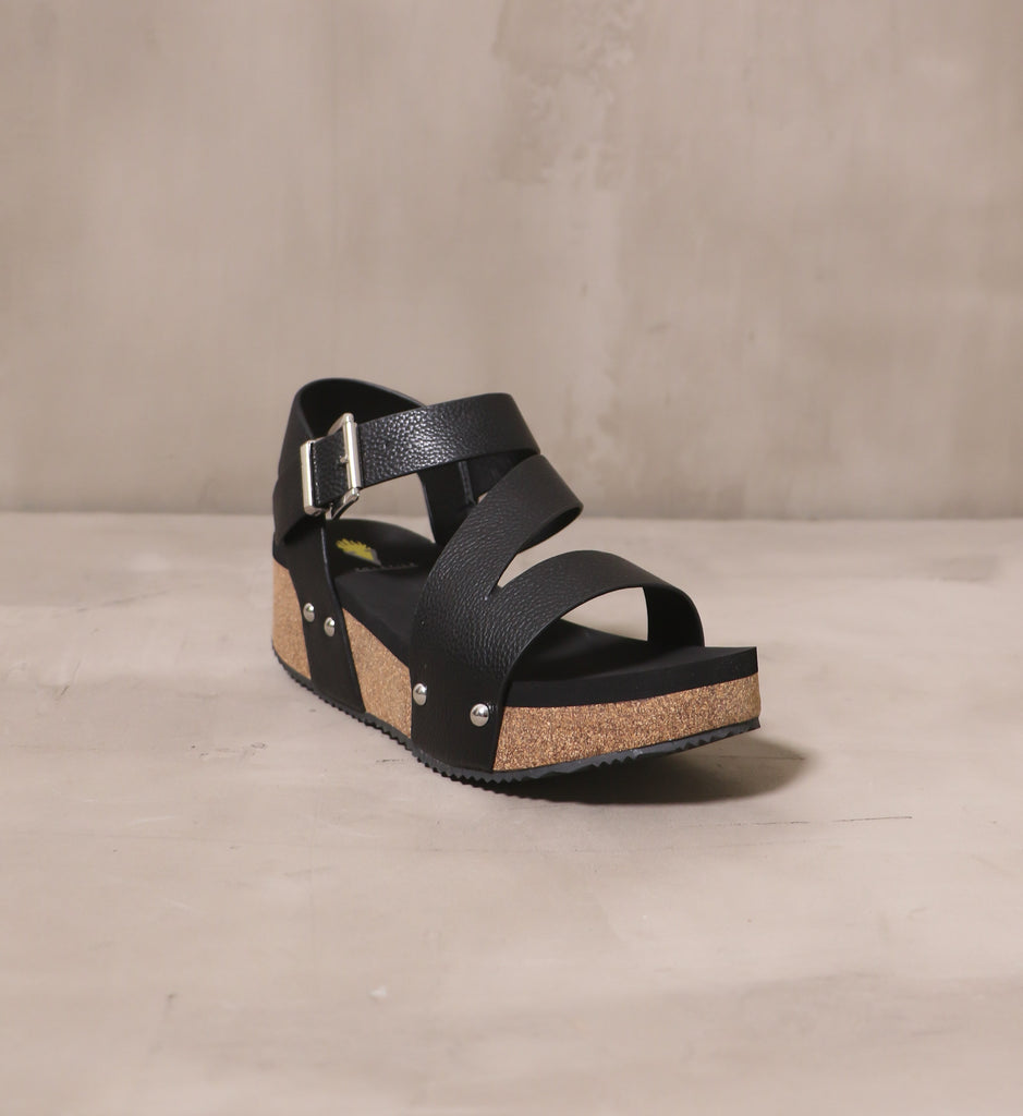 front of the open toe all strapped in wedge with black leather straps and cork platform sole
