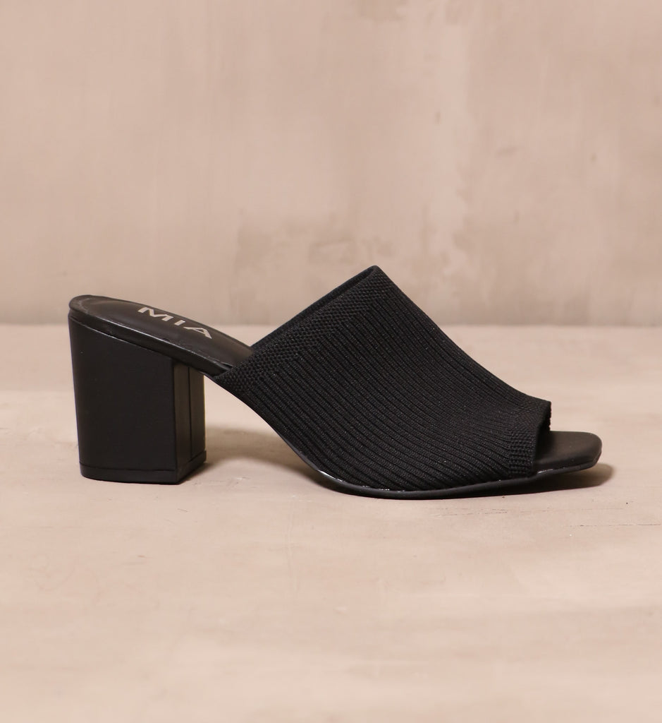 outer side of the black ribbed fabric upper on the scandinavian style textile sandal heel