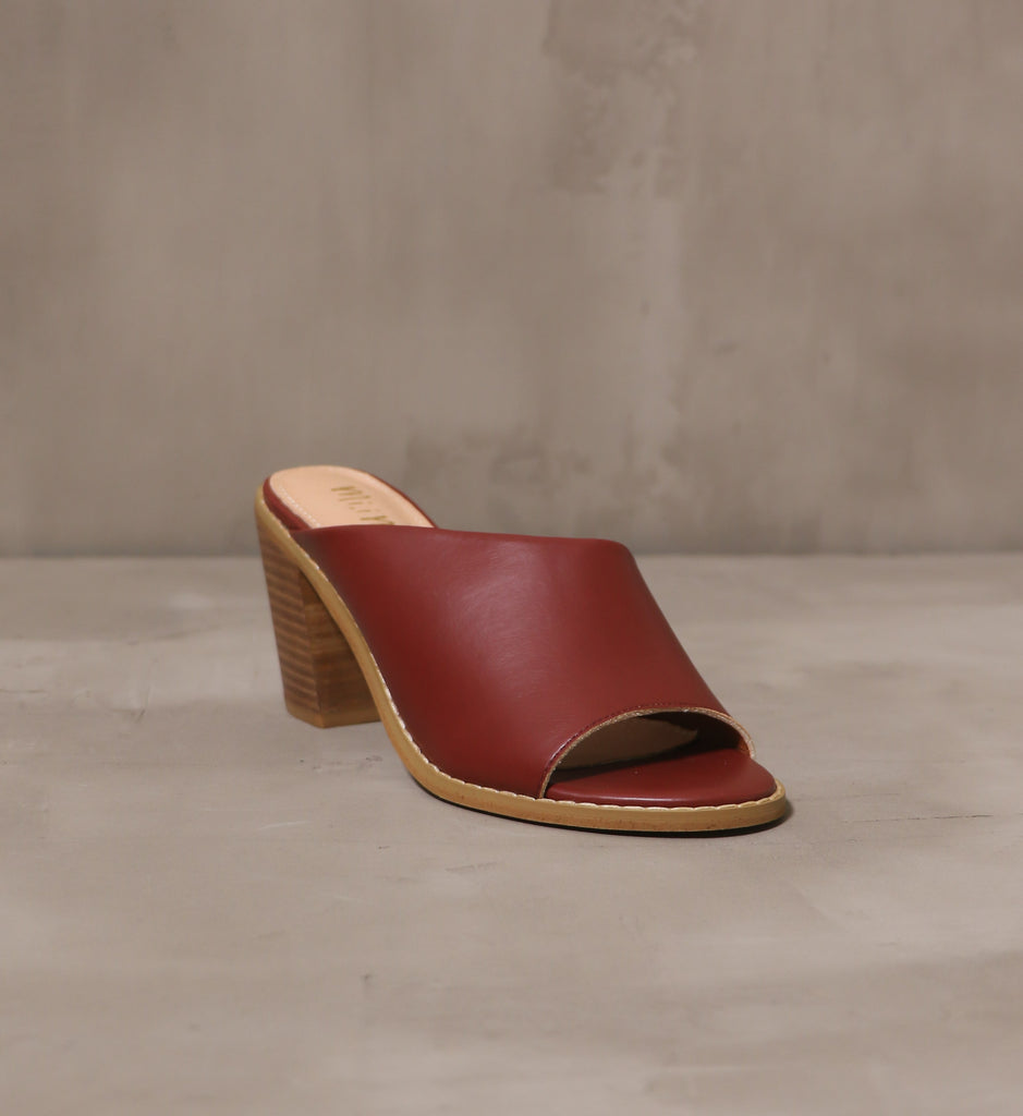 front of the open toe brick up your feet heel with asymmetrical upper and brown wood sole