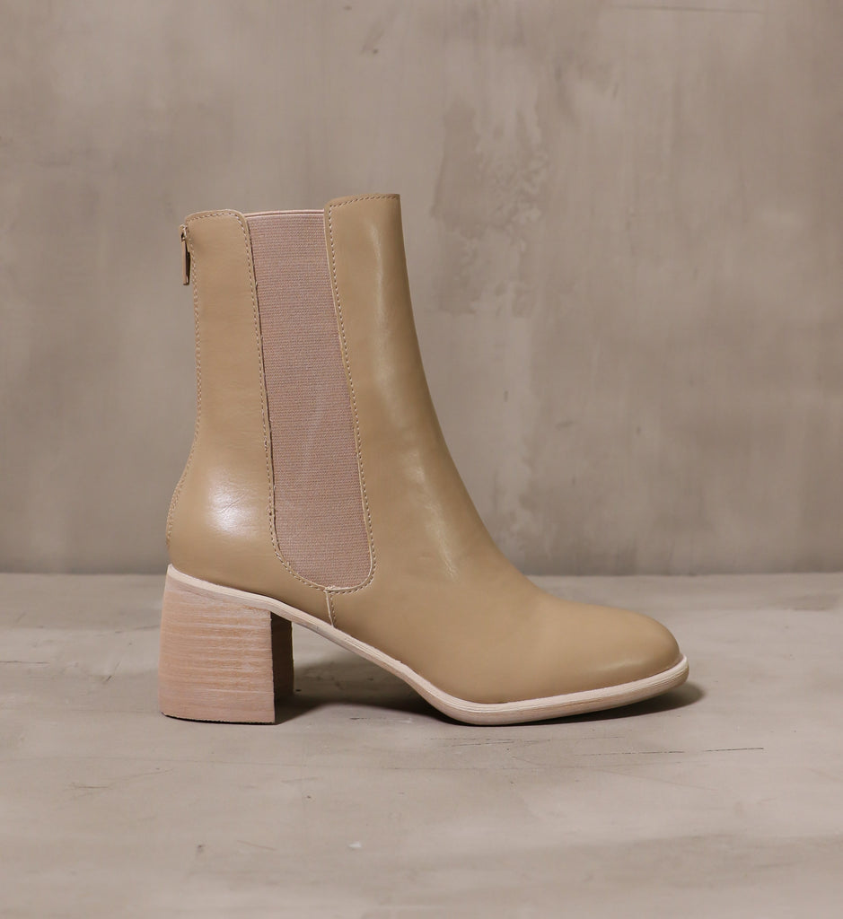 outer side of the consider it done boot with elastic gore panel and stacked wood block heel
