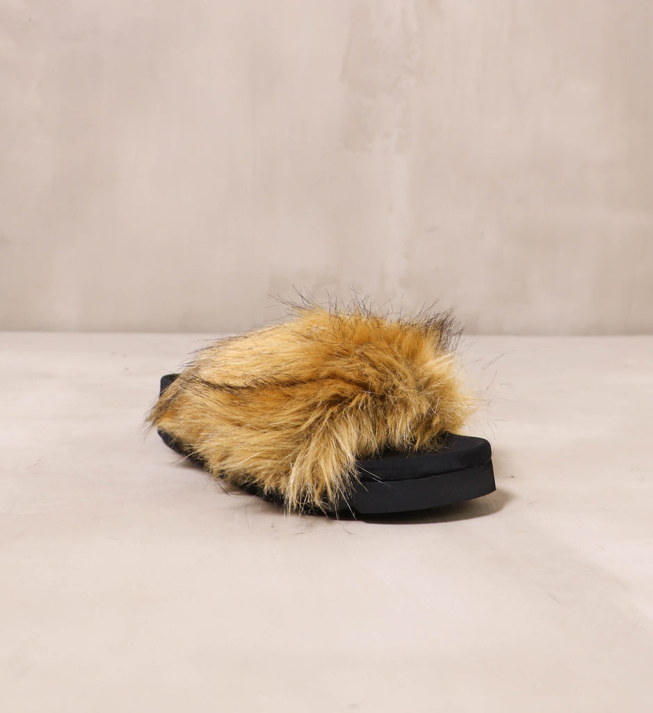 front of the open toe don't furry about me slide with black sole and tan fur upper