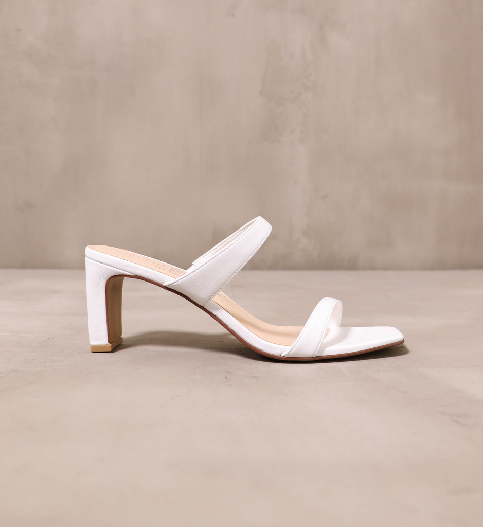 outer side of the white leather french manicure heel with leather upper and square toe bed