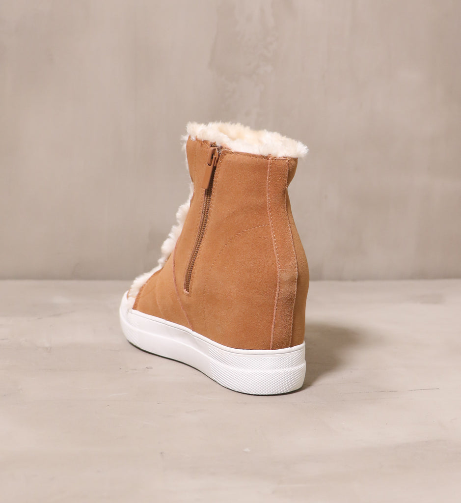 back of the tan fur wedge and fur all sneaker wedge with tan suede fabric