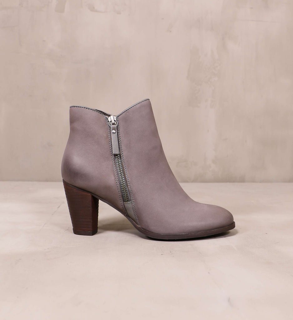 outer side of the heart zips a beat grey bootie with brown wood tapered heel