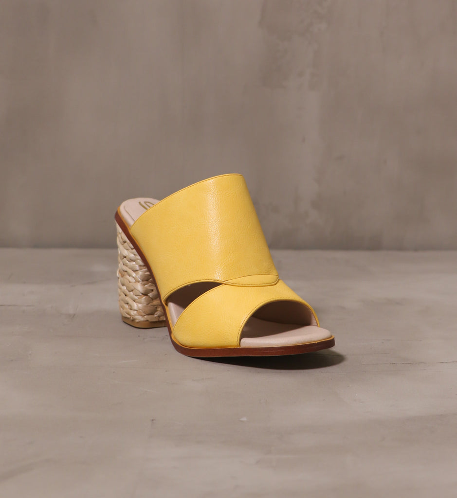 front of the open toe hello yellow heel with leather upper and cutout detail