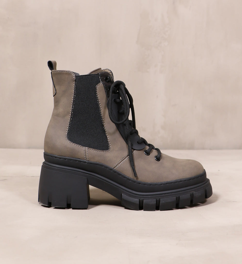 outer side of the black lug sole hike it or not boot with black elastic panel and black laces