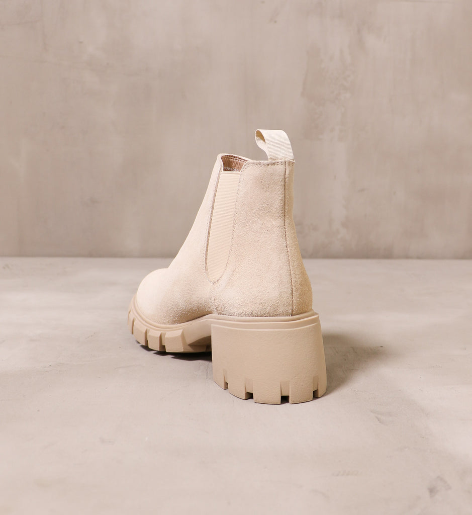 back of the sand suede upper and chunky rubber block heel