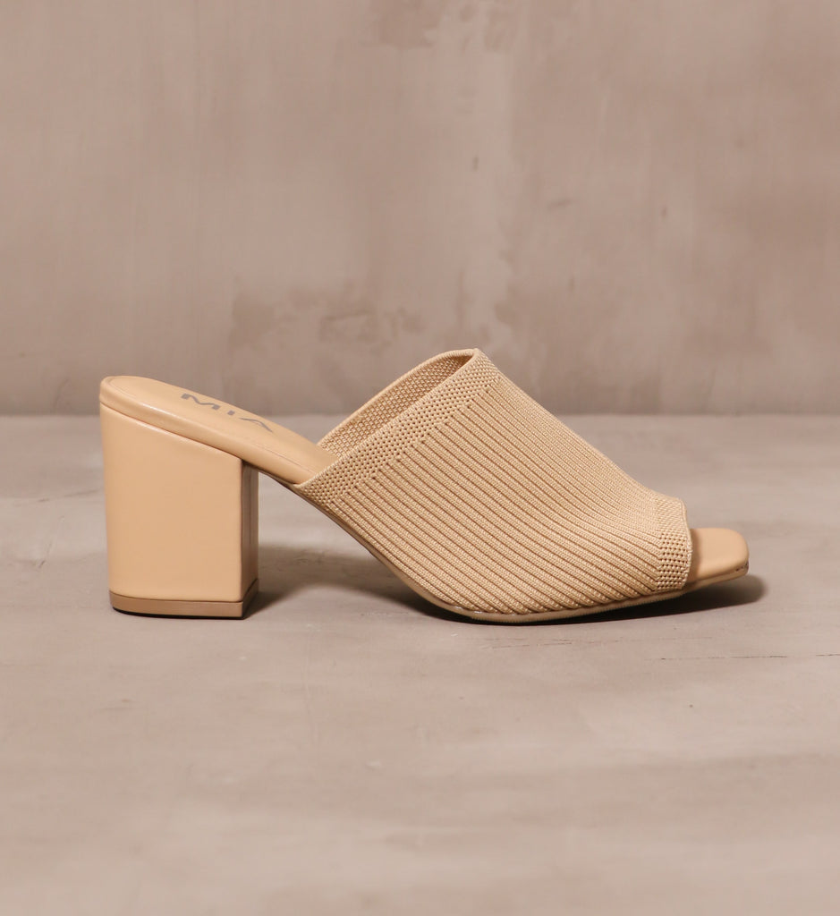 outer side of the scandinavian style textile sandal heel with ribbed knit fabric thick strap and vegan leather wrapped heel