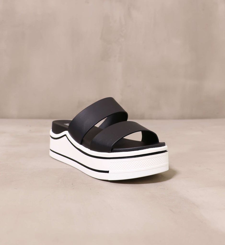 front of the open toe platform and opinion sandal with chunky white rubber platform sole
