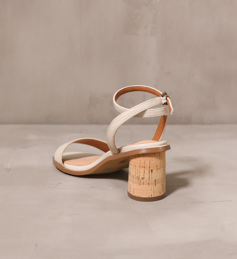 back of the cork block heel with thin beige strap on the pop the cork heel