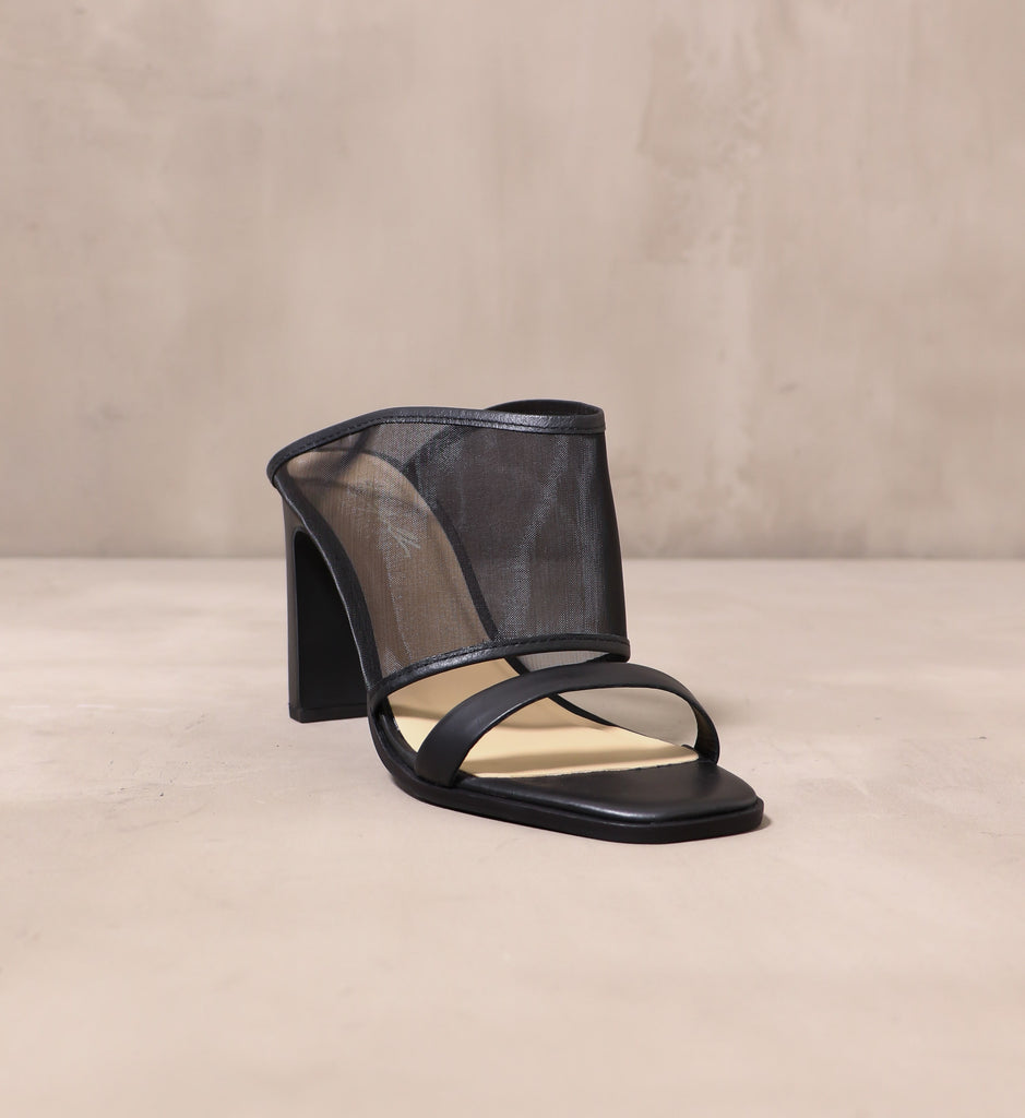 front of the open toe seven sheer itch heel with thin leather strap and thick organza fabric strap