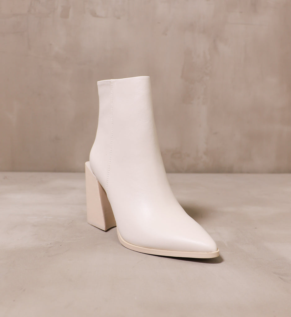 front of the pointed toe she's so modern boot with leather upper and beige sole