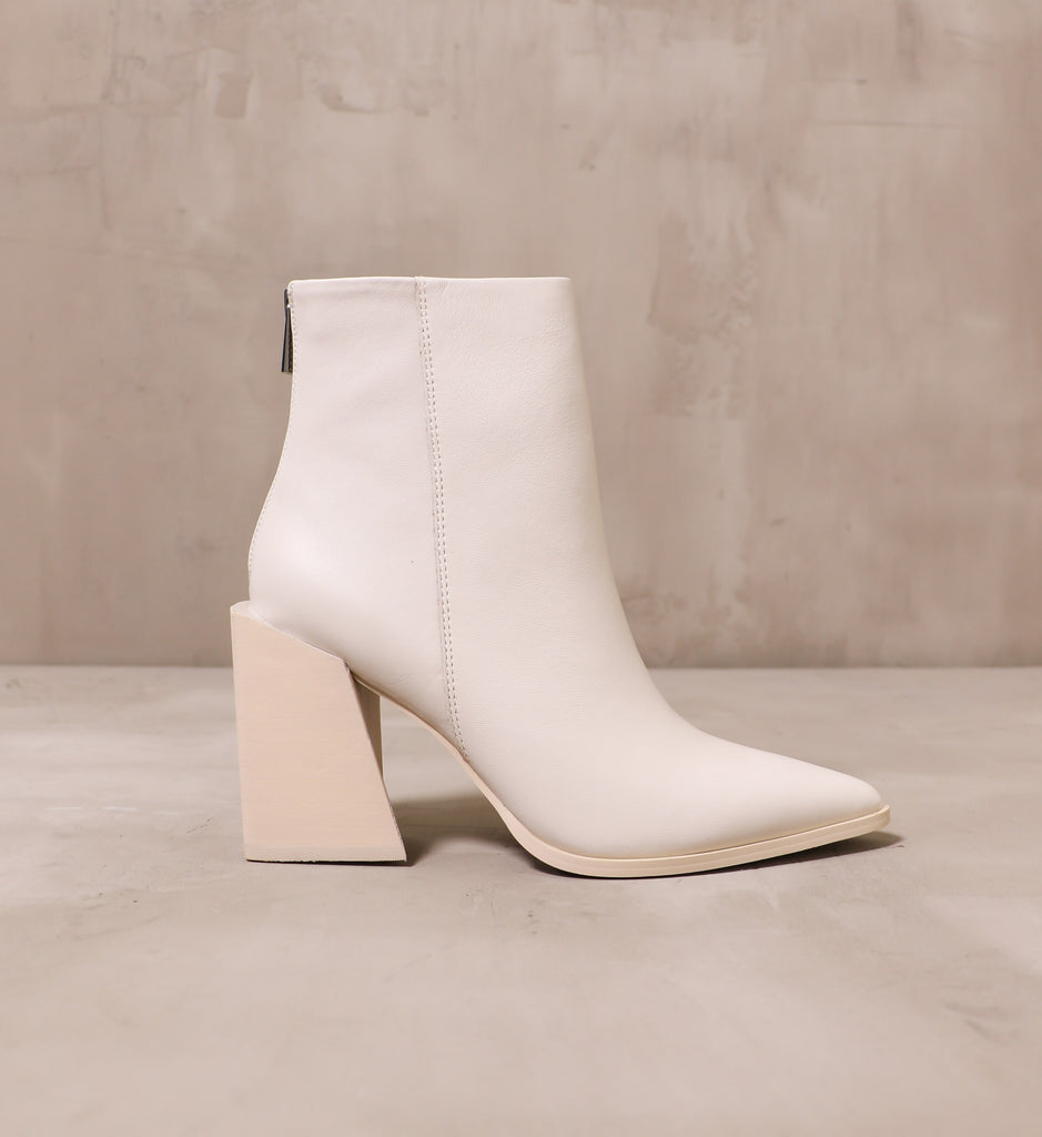 outer side of the she's so modern boot with leather upper and angled block heel