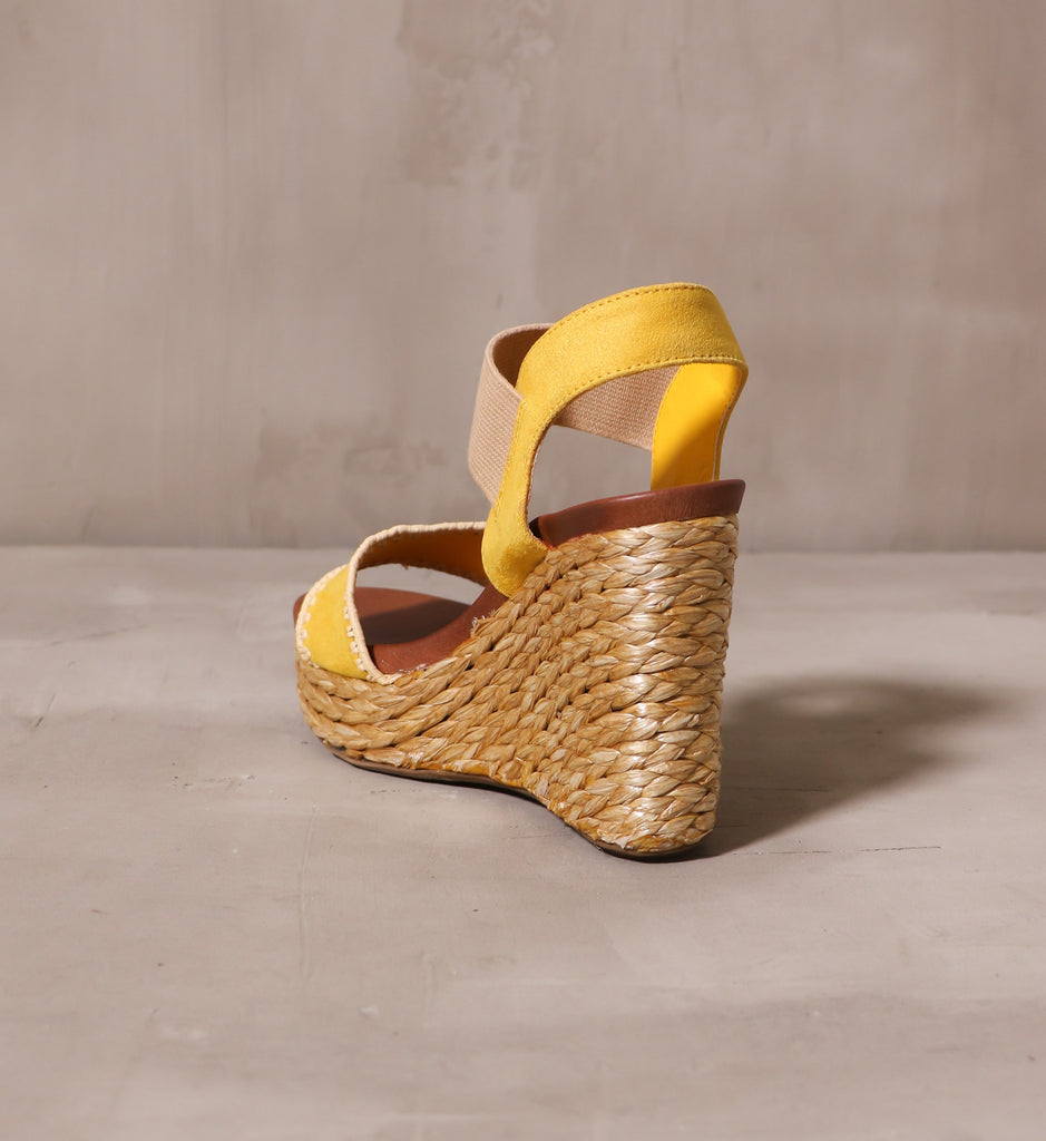 back of the braided rope wrapped heel on the mustard yellow shore thing wedge
