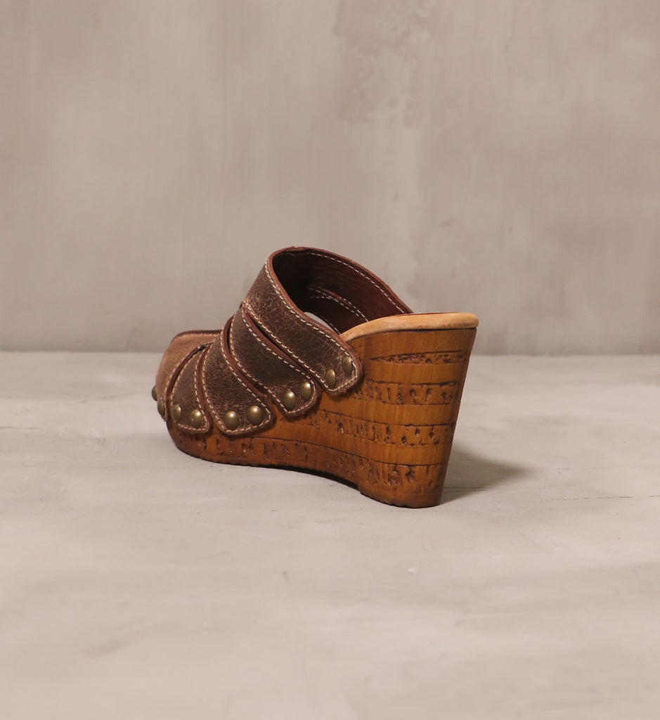 back of the sky's the rivet wedge with open back and textured faux wood stacked heel