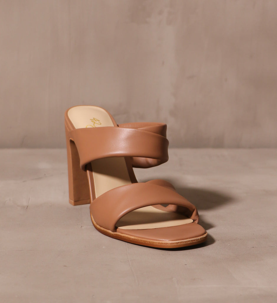 front of the open square toe bed on the state of luxe heel with two leather straps across the bridge