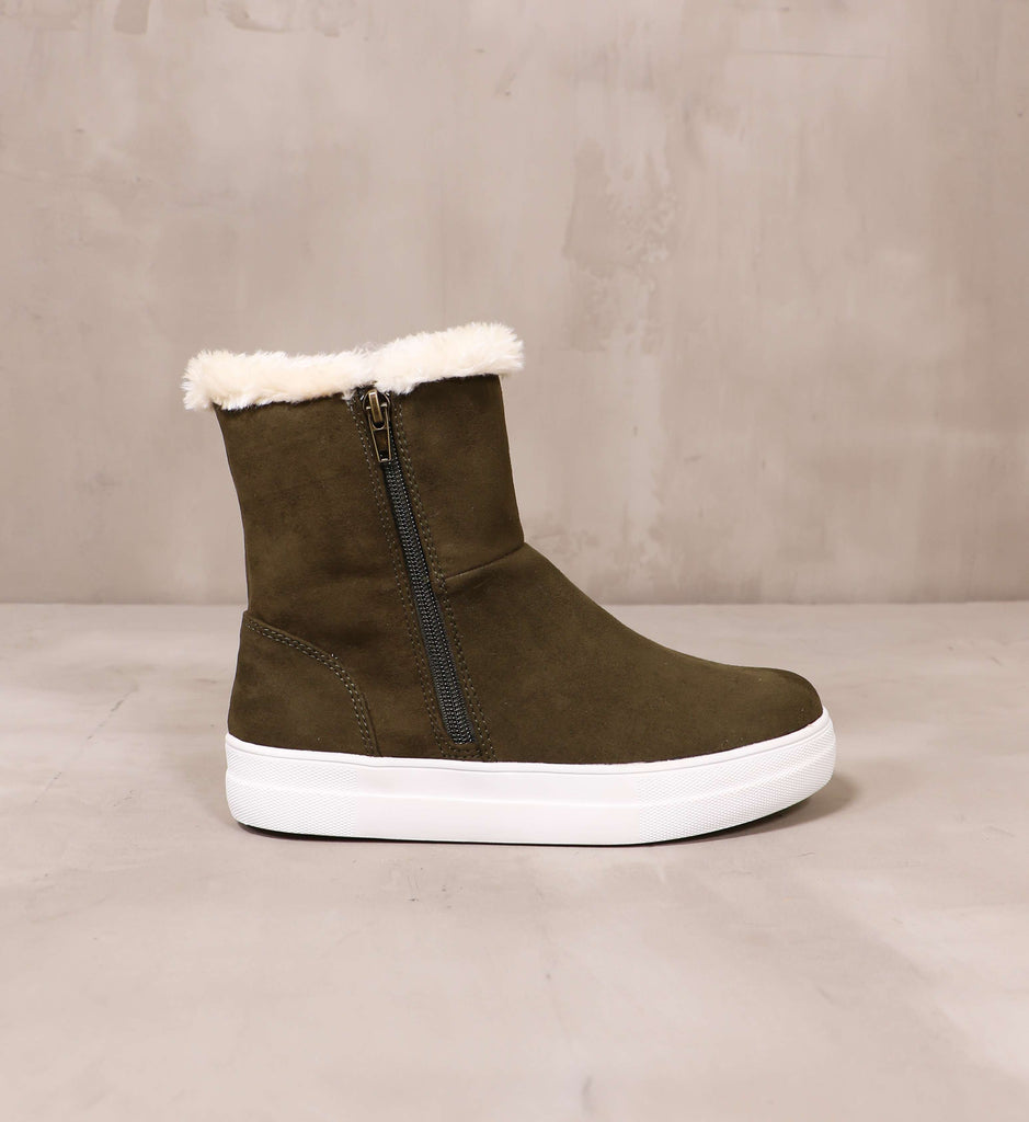 outer side of the take it outside olive convertible sneaker with zipped up upper