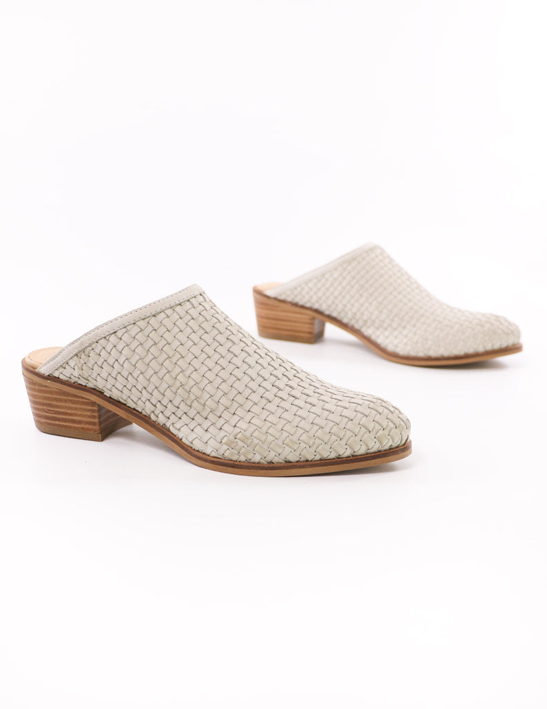 close up of the ice beige volatile the woven one mules on white background - elle bleu shoes