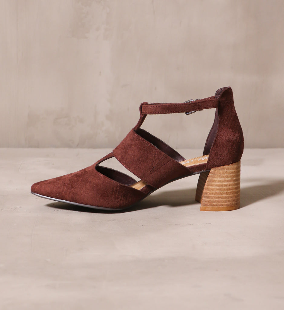 inner side of the wine and dine heel with stacked wood block heel and upper cutout details