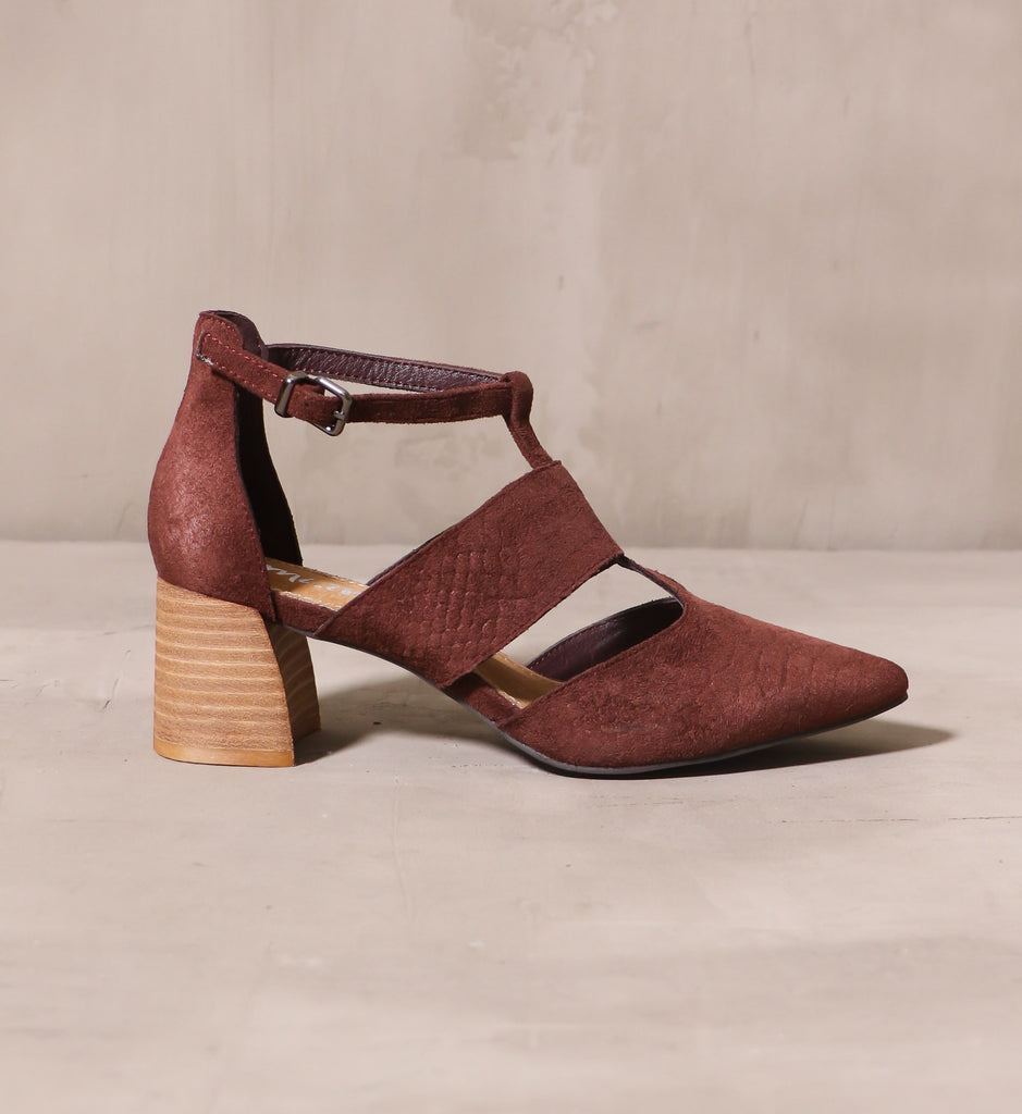 outer side of the wine and dine heel with t-strap upper and stacked wood block heel