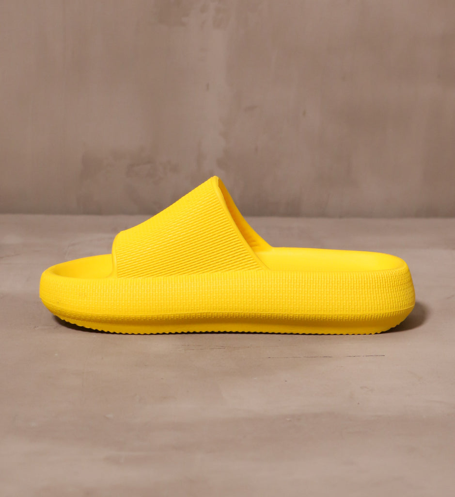 inner side of the yellow solid lightweight rubber late to the foam party slip on pool slides