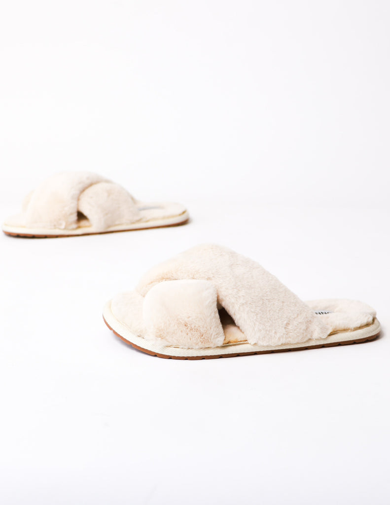 Close up of the beige fur the dreamers slipper on white background