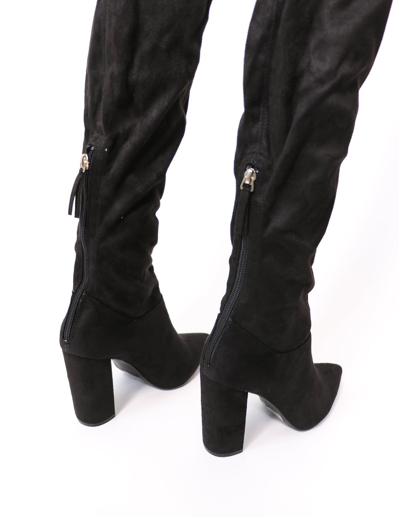 Back zipper detail on the black over the knee thigh's the limit boot