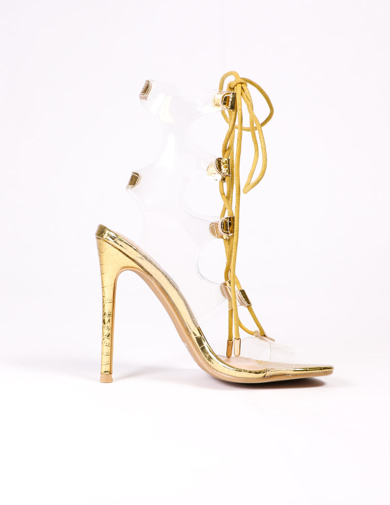 side of the clear and gold lace up pvc heel - elle bleu