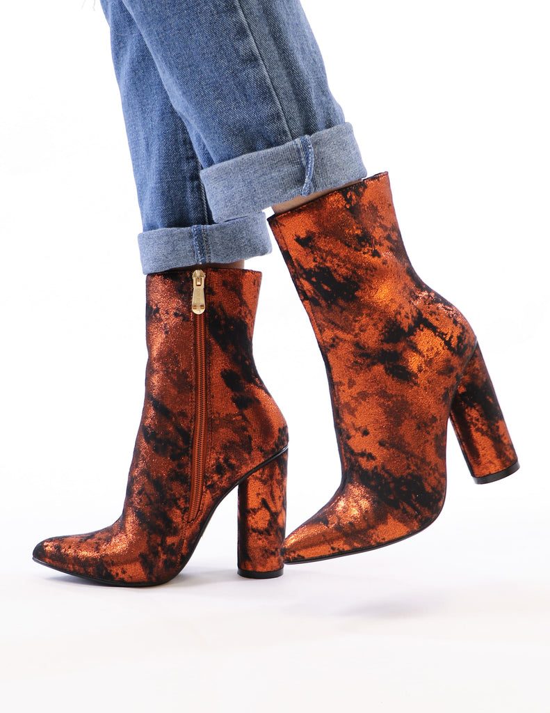 model standing in rust metallic booties - elle bleu shoes