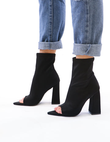 model standing in black sit tight bootie - elle bleu shoes