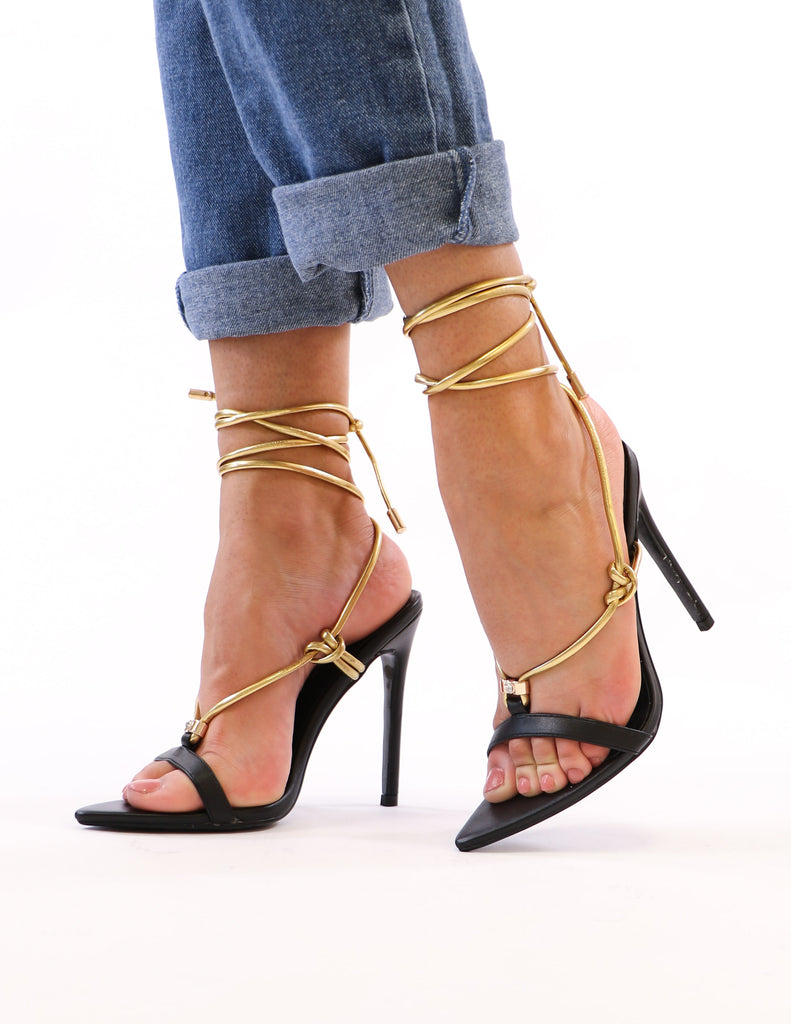 model standing in black and gold lace up heels - elle bleu shoes