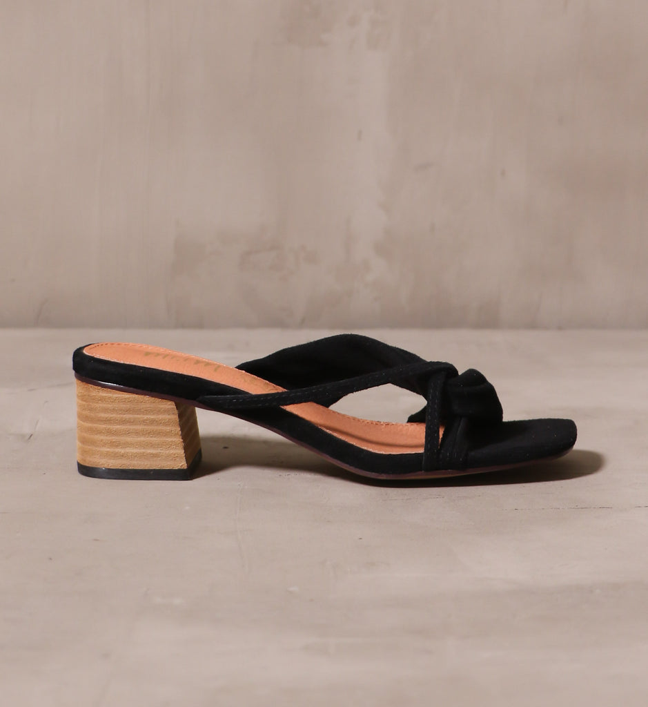 outer side of the black suede aesthetic emotions block heel with stacked wood heel and leather insole