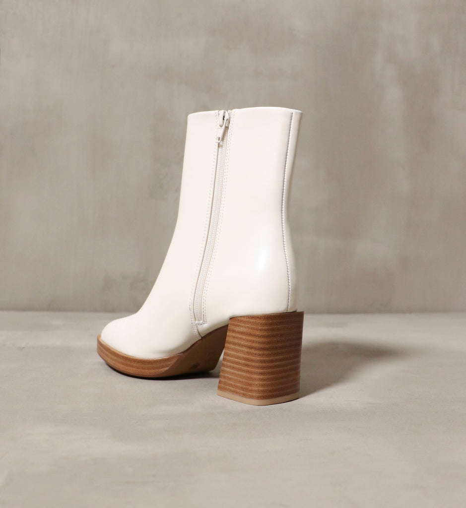 The Out on a High Bootie has a stacked wood heel and one inch platform.