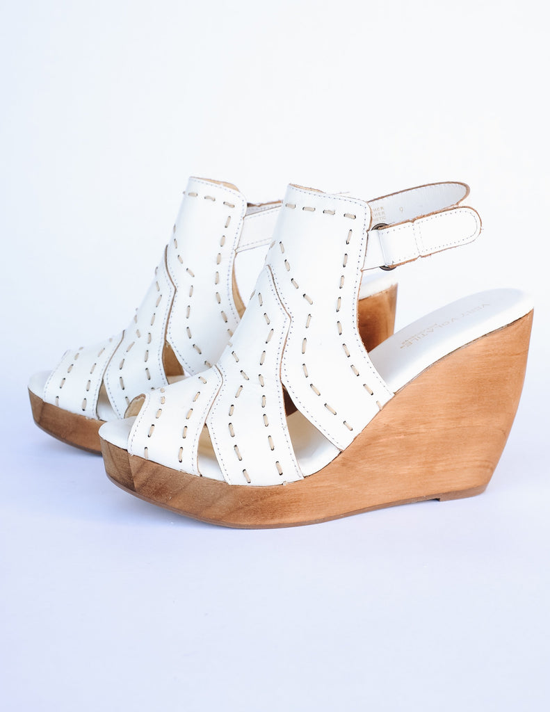 White bolanos wedge with open toe and open back on white background