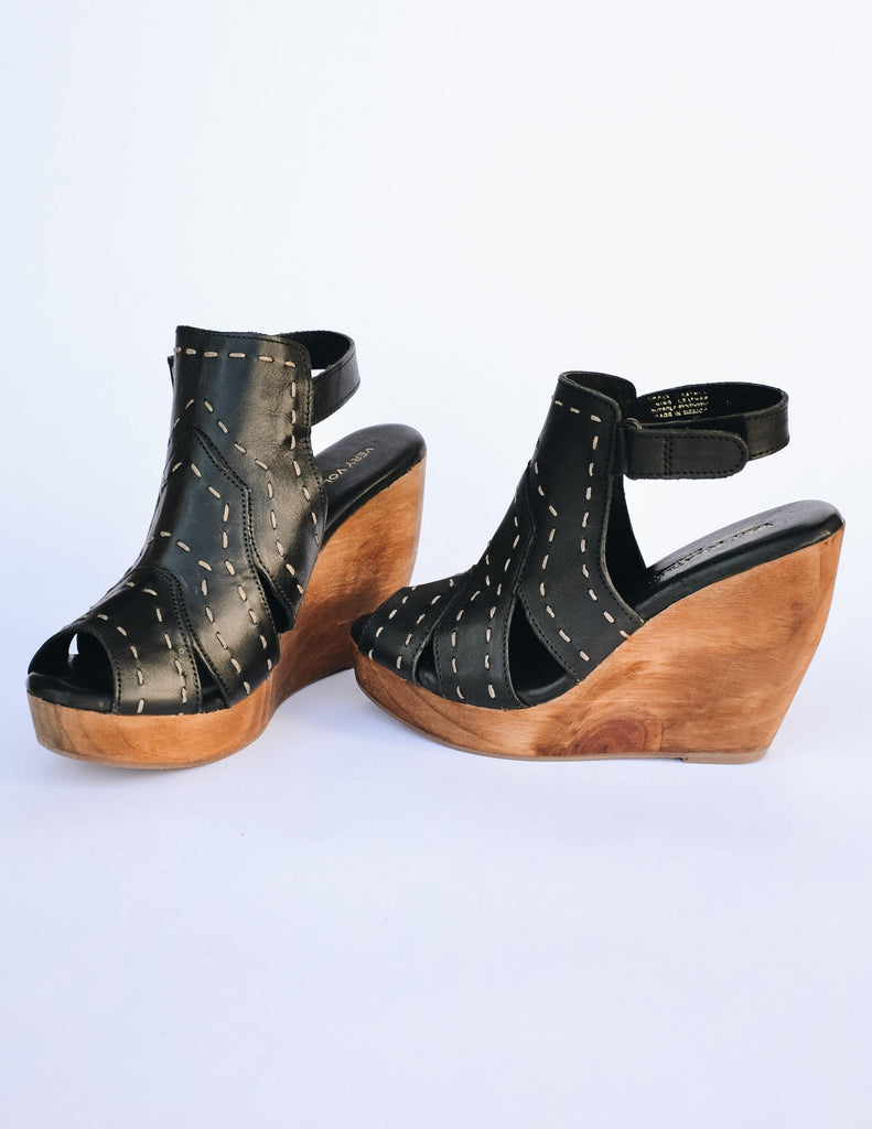 Black bolanos wedge with western inspired upper stitching and wood heel
