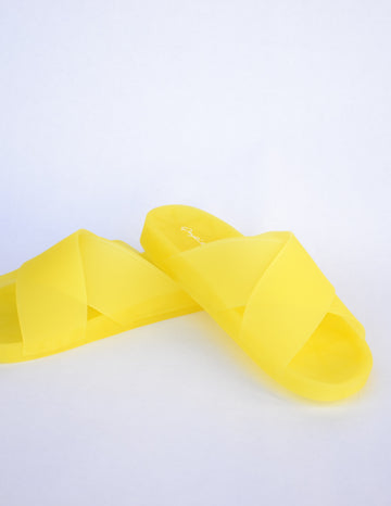 Close up of open toe open back slide sandal in yellow