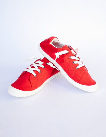 Red sneaker on white background - elle bleu