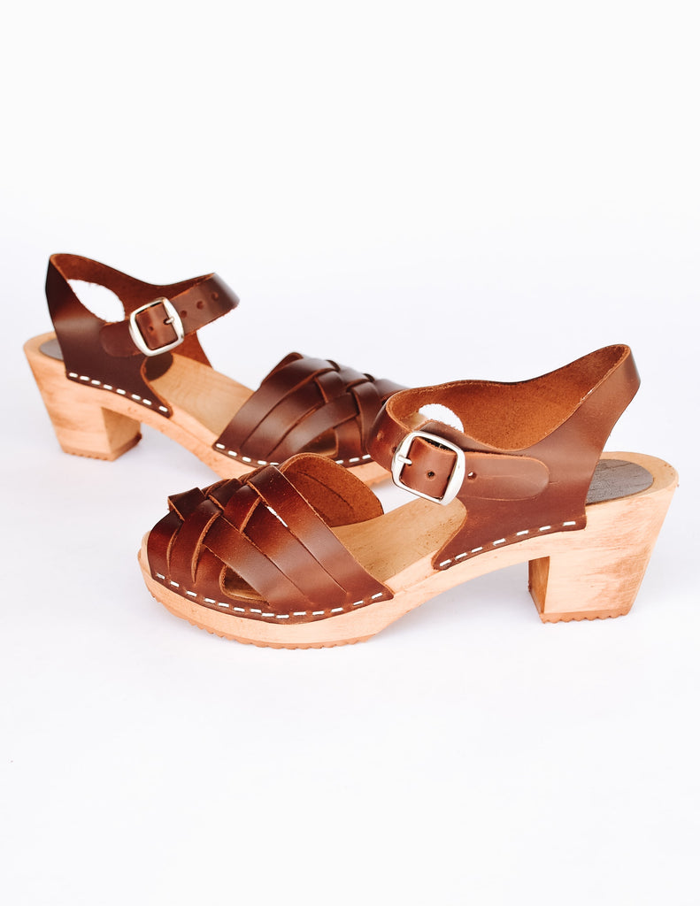 Brown open toe dream weaver clogs in brown with silver buckle, wood sole