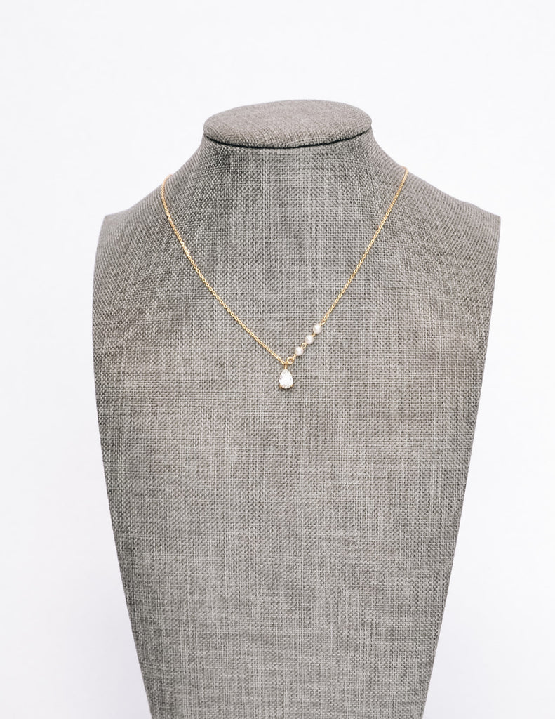 Gold statement grey caprie necklace on form - elle bleu