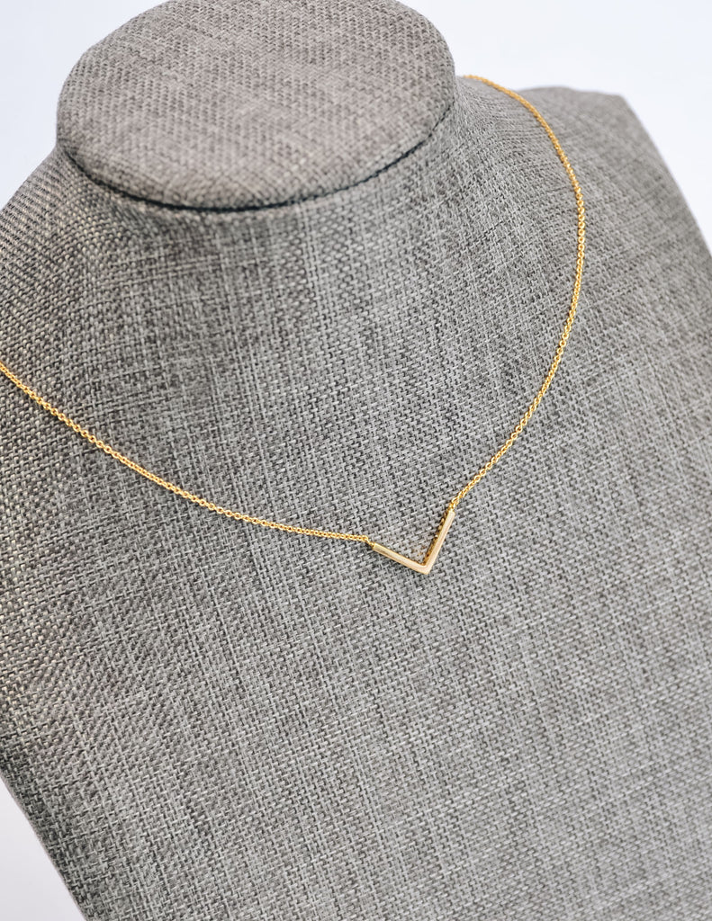 Gold statement grey necklace on form - elle bleu