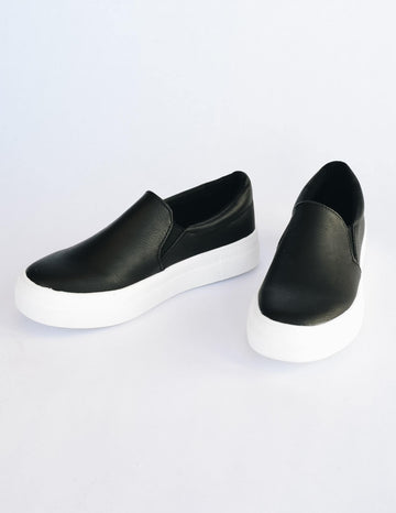 Black vegan leather slip on sneaker with white vulcanized rubber sole
