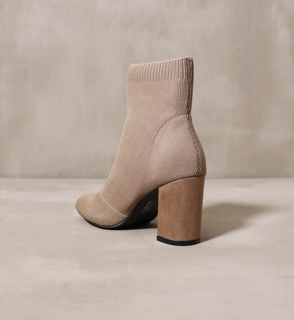 The Rumor Has Knit bootie facing away from the camera for a heel profile.
