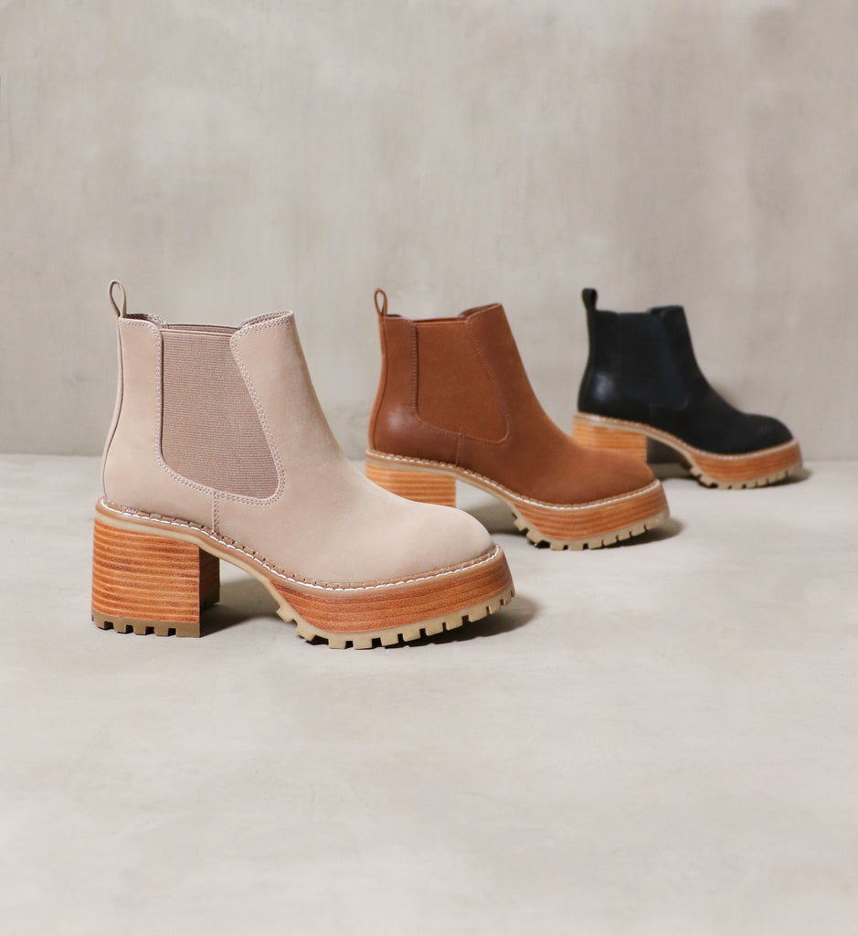 All 3 colors of the Sole Obsession boot, a lug sole chelsea boot, in black, cognac and stone.