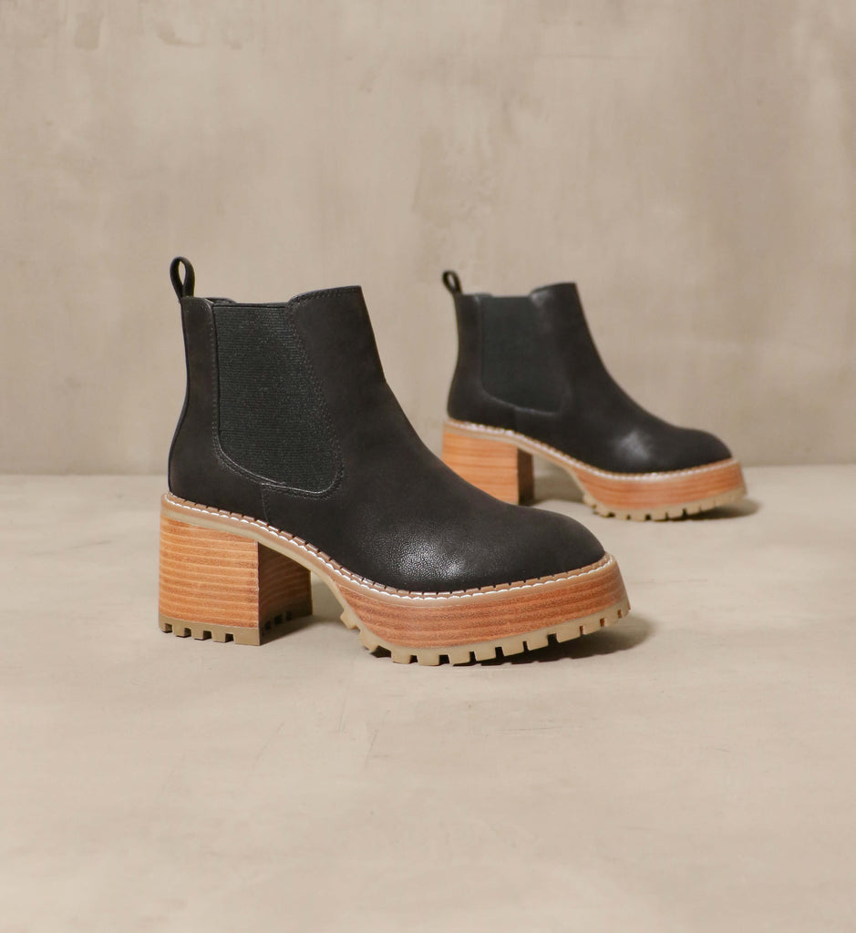 Sole Obsession black chelsea boot on cement background - Elle Bleu Shoes