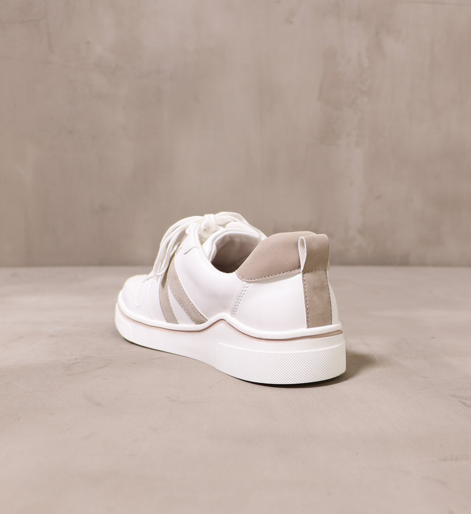 back of the white between the lines sneaker with taupe pull strap and details