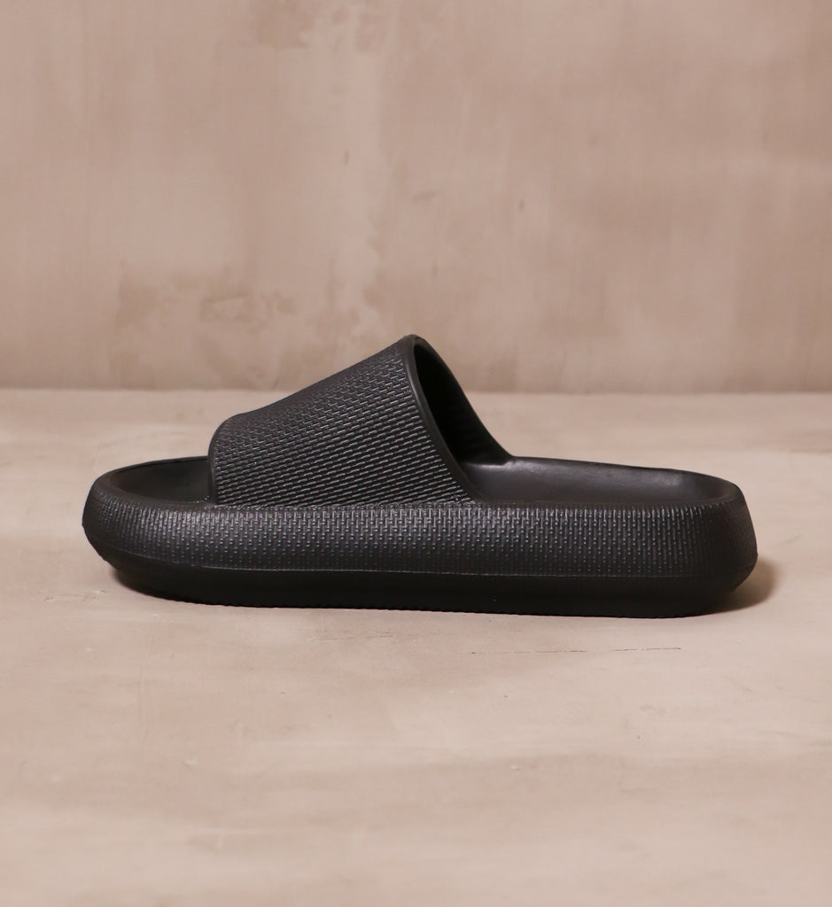 inner side of the all black lightweight molded rubber late to the foam party mia pool slide