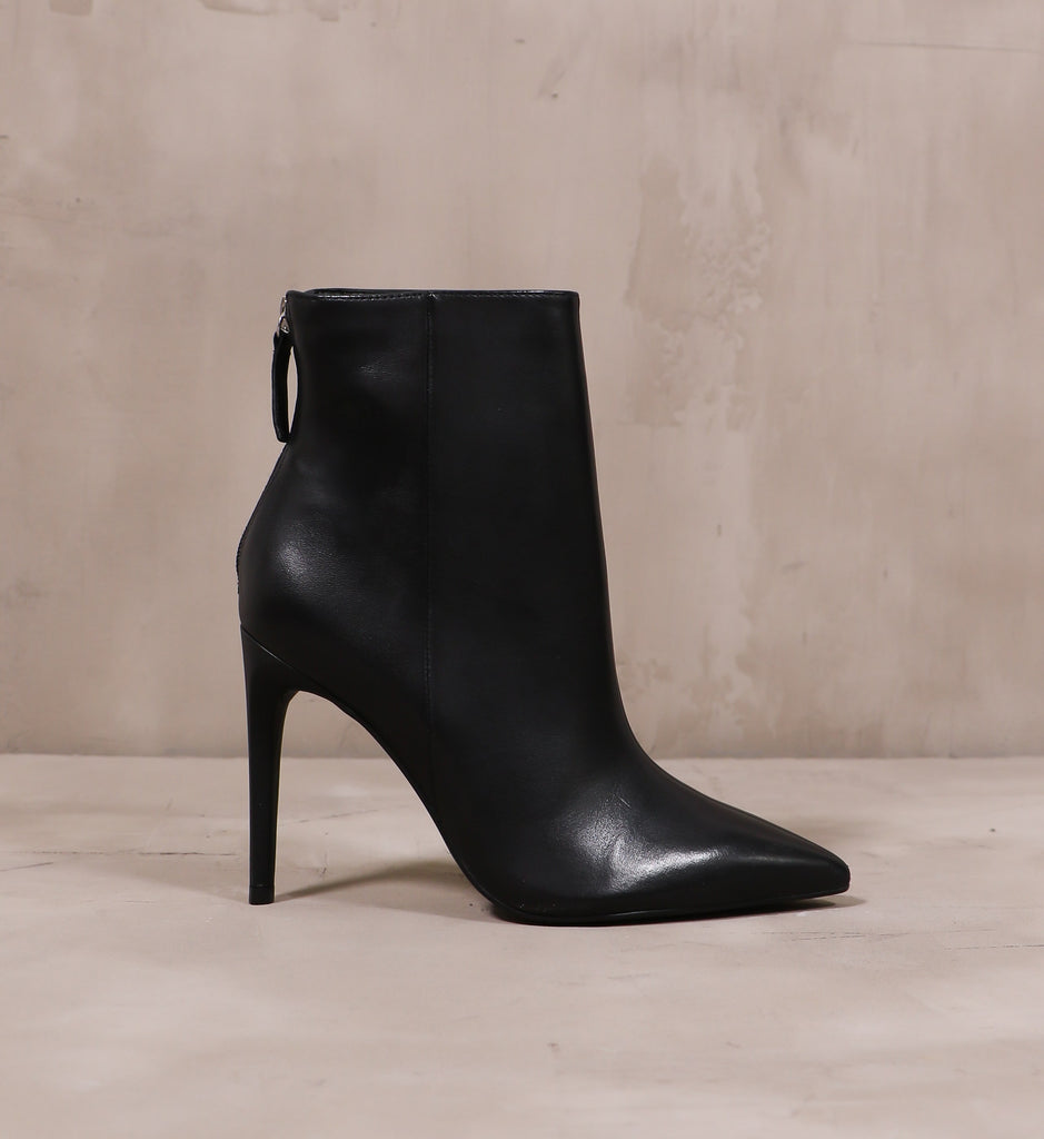 outer side of the leather stiletto heel on the noir or never bootie